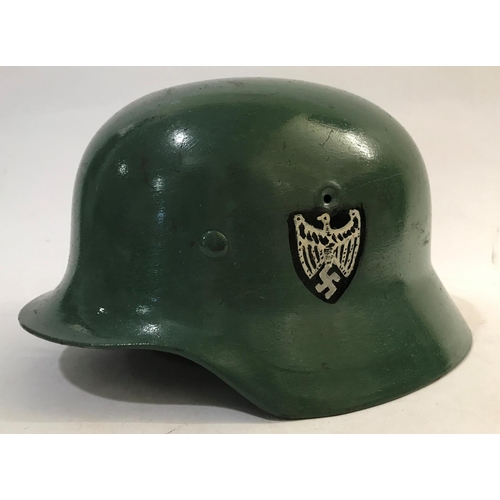 708 - AN EARLY SECOND WORLD WAR BRODIE TYPE HELMET AND TWO OTHERS. A Brodie type helmet stamped to the und... 