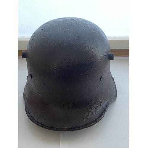 712 - A FIRST WORLD WAR GERMAN M16 STEEL HELMET. In excavated condition with twin lug vents and modern lea... 