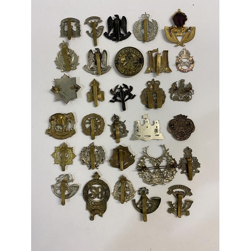 717 - A COLLECTION OF REGIMENTAL CAP BADGES. A collection of thirty cap badges to include examples for the... 