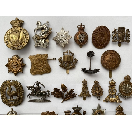 719 - A COLLECTION OF REGIMENTAL CAP BADGES. A collection of thirty cap badges to include examples for the... 