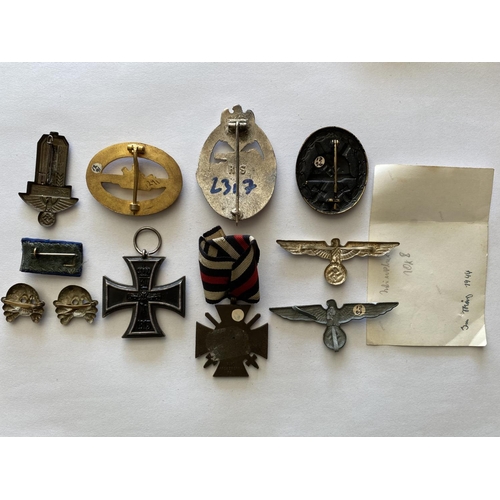 724 - A 1914 IRON CROSS AND A COLLECTION OF OTHER GERMAN BADGES AND MEDALS. A Great War Iron Cross, 2nd Cl... 