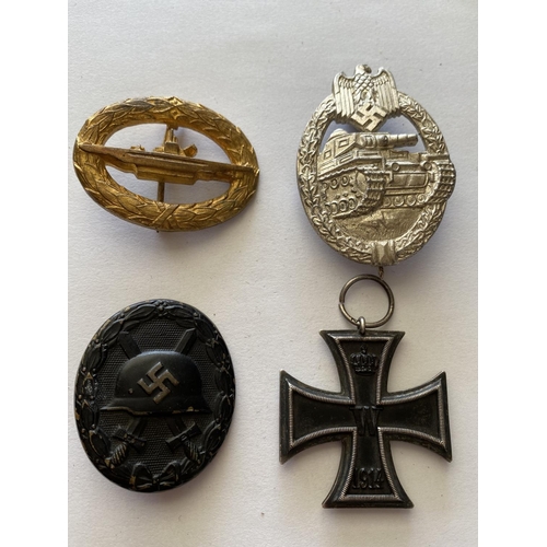 724 - A 1914 IRON CROSS AND A COLLECTION OF OTHER GERMAN BADGES AND MEDALS. A Great War Iron Cross, 2nd Cl... 