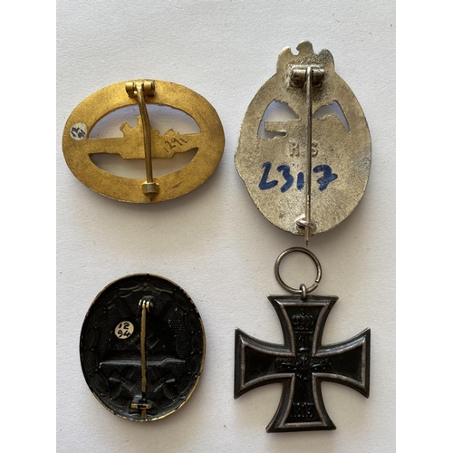 724 - A 1914 IRON CROSS AND A COLLECTION OF OTHER GERMAN BADGES AND MEDALS. A Great War Iron Cross, 2nd Cl... 