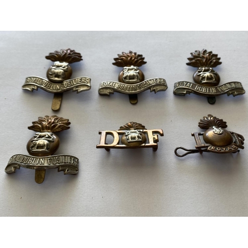 726 - A COLLECTION OF SIX ROYAL DUBLIN FUSILIERS BADGES. Shoulder and cap badges of the Royal Dublin Fusil... 