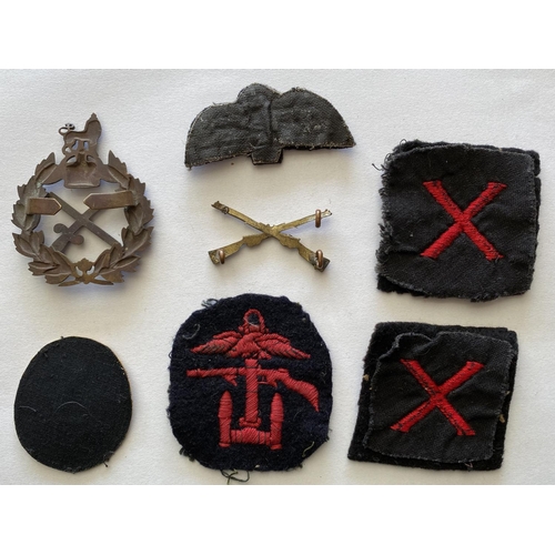 727 - A STAFF OFFICERS CAP BADGE AND OTHERS. A cap bad with crossed baton and sword, a crossed rifles badg... 