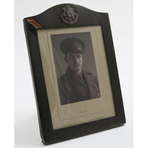 735 - AN EAST SURREY REGIMENT PHOTOGRAPH FRAME. A rectangular photograph frame with central 'East Surrey' ... 