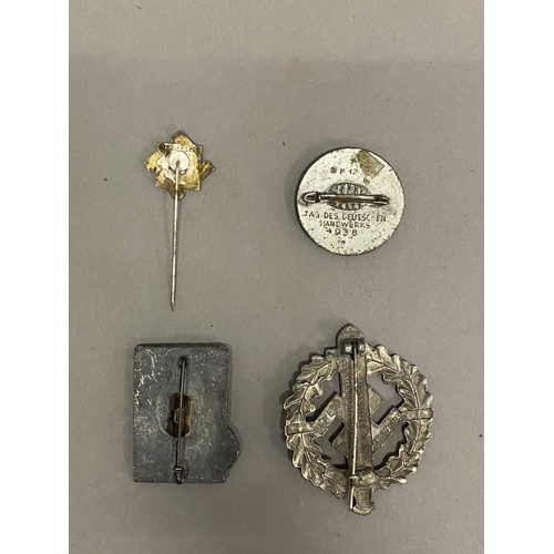 740 - A SECOND WORLD WAR PERIOD SA SPORTS BADGE. A pin backed sports badge in the form of a short sword in... 