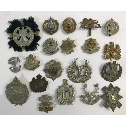 744 - A COLLECTION OF REGIMENTAL CAP BADGES. A collection of 20 regimental cap badges including Cameron Hi... 