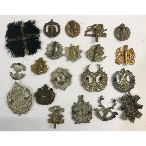 744 - A COLLECTION OF REGIMENTAL CAP BADGES. A collection of 20 regimental cap badges including Cameron Hi... 