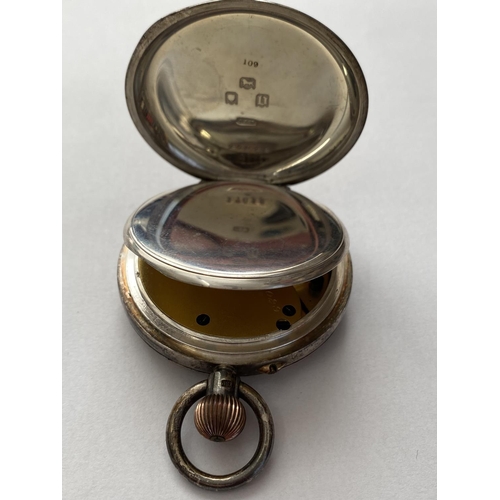 753 - A SILVER CASED ARMY ISSUE POCKET WATCH. An open faced pocket watch, the black dial with seconds dial... 