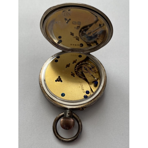 753 - A SILVER CASED ARMY ISSUE POCKET WATCH. An open faced pocket watch, the black dial with seconds dial... 