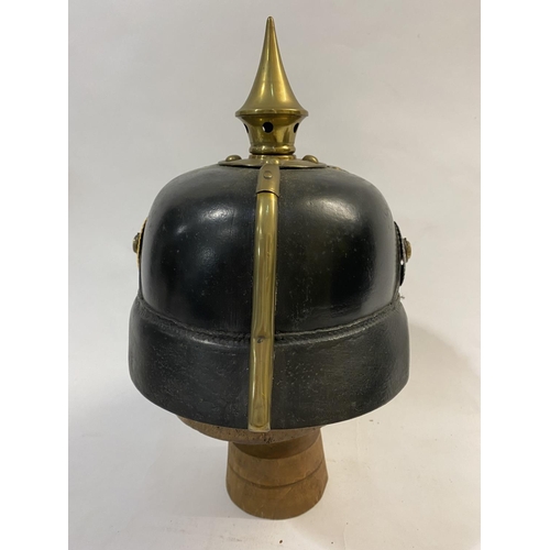 755 - A FIRST WORLD WAR GERMAN BADEN PICKELHAUBE DATED 1915. Of domed lacquered black leather with a short... 