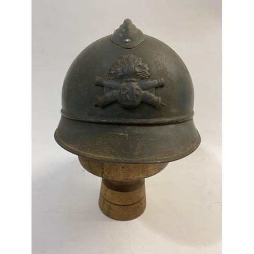 756 - A FIRST WORLD WAR FRENCH ARTILLERY ADRIAN PATTERN STEEL HELMET AND COVER. A first World War French s... 