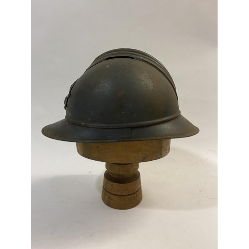 756 - A FIRST WORLD WAR FRENCH ARTILLERY ADRIAN PATTERN STEEL HELMET AND COVER. A first World War French s... 