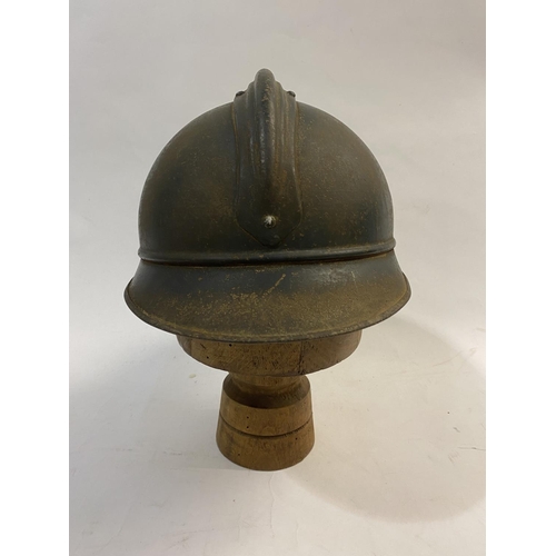 756 - A FIRST WORLD WAR FRENCH ARTILLERY ADRIAN PATTERN STEEL HELMET AND COVER. A first World War French s... 