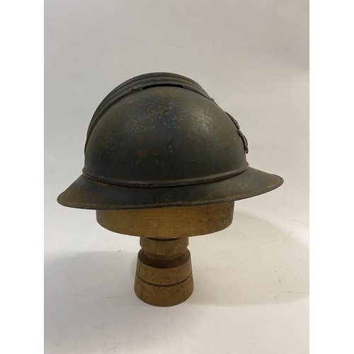 756 - A FIRST WORLD WAR FRENCH ARTILLERY ADRIAN PATTERN STEEL HELMET AND COVER. A first World War French s... 