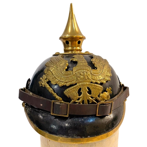 759 - A PRUSSIAN M1915 INFANTRY PICKELHAUBE AND COVER. With a brass spike above five holes on a base plate... 