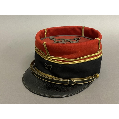 763 - A MID 20TH CENTURY FRENCH INFANTRY OFFICERS KEPI, 27TH INFANTRY REGIMENT. A Kepi cap with red fabric... 