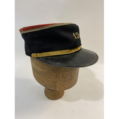 764 - A MID 20TH CENTURY FRENCH INFANTRY OFFICERS KEPI, 12TH INFANTRY REGIMENT. A Kepi cap with red fabric... 