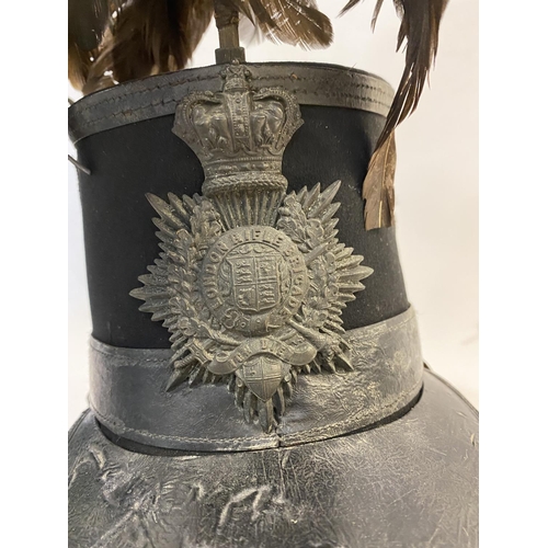 768 - A VICTORIAN 1861 PATTERN SHAKO FOR THE LONDON RIFLE BRIGADE. With an oval flat top with feather plum... 