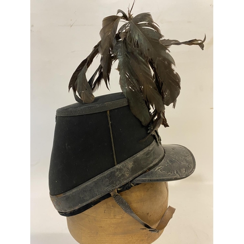 768 - A VICTORIAN 1861 PATTERN SHAKO FOR THE LONDON RIFLE BRIGADE. With an oval flat top with feather plum... 