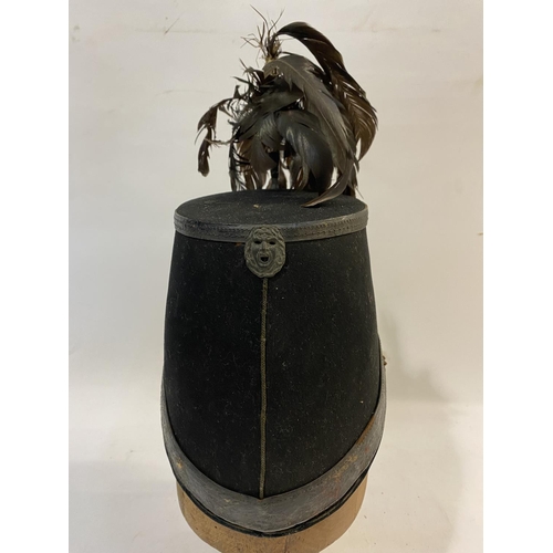 768 - A VICTORIAN 1861 PATTERN SHAKO FOR THE LONDON RIFLE BRIGADE. With an oval flat top with feather plum... 