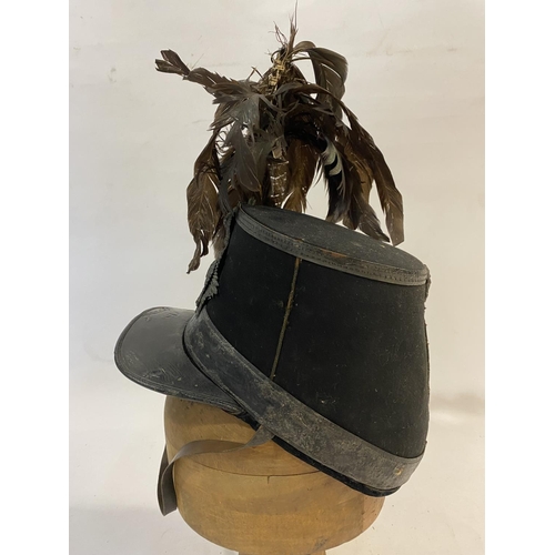 768 - A VICTORIAN 1861 PATTERN SHAKO FOR THE LONDON RIFLE BRIGADE. With an oval flat top with feather plum... 