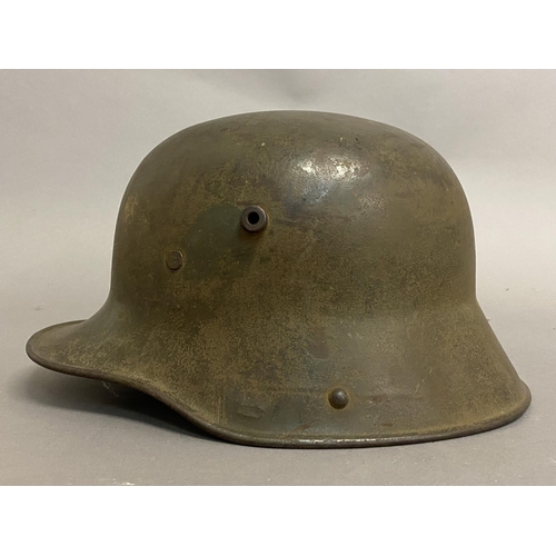 770 - A FIRST WORLD WAR GERMAN M16 PATTERN HELMET. A German steel helmet with pronounced air vents and tur... 