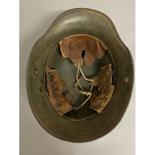 770 - A FIRST WORLD WAR GERMAN M16 PATTERN HELMET. A German steel helmet with pronounced air vents and tur... 