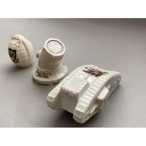 781 - THREE PIECES OF FIRST WORLD WAR CRESTED CHINA. A first World War tank by Arcadian China with a Birmi... 