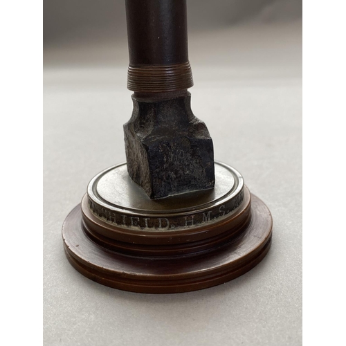 784 - A FIRST WORLD WAR NAVAL SOUVENIR. A desk ornament with central bullet shaped upright on a circular b... 