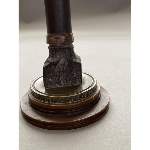 784 - A FIRST WORLD WAR NAVAL SOUVENIR. A desk ornament with central bullet shaped upright on a circular b... 