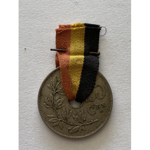 796 - A POST GREAT WAR BELGIAN PRESENTATION 25 CENT COIN. A 25 cent coin threaded with a Belgian Red yello... 