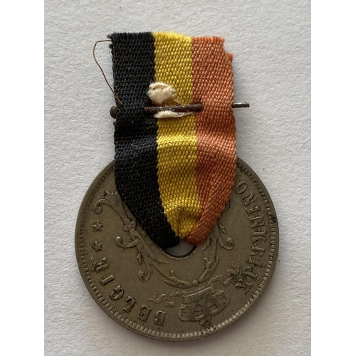 796 - A POST GREAT WAR BELGIAN PRESENTATION 25 CENT COIN. A 25 cent coin threaded with a Belgian Red yello... 