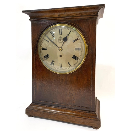 802 - A LARGE R.A.F. MANTEL CLOCK. A large oak cased mantel clock with 20cm domed and silvered dial with R... 