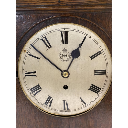 802 - A LARGE R.A.F. MANTEL CLOCK. A large oak cased mantel clock with 20cm domed and silvered dial with R... 