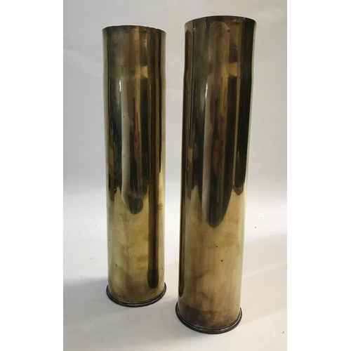 807 - A PAIR OF BRASS SHELL CASES. Each marked to the base '75 DEC MA I 60 L 14 S', 35cm tall, 8.5cm wide.... 