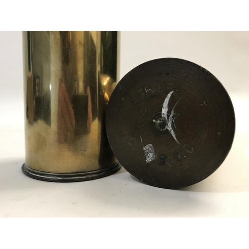 807 - A PAIR OF BRASS SHELL CASES. Each marked to the base '75 DEC MA I 60 L 14 S', 35cm tall, 8.5cm wide.... 