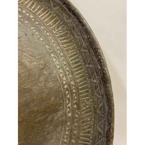 811 - A LARGE CRICULAR SOMALIAN SHIELD. Of thick cow hide with a raised central boss with skin cover, the ... 