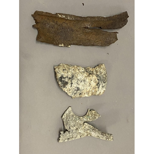 824 - THREE LARGE CRASH FRAGMENTS FROM AN AVRO LANCASTER. Three large fragments from a crash sight, possib... 