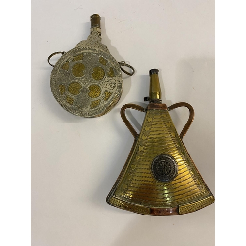 828 - A MORROCAN TYPE POWDER FLASK AND ANOTHER. A brass and copper powder flask of irregular form with cop... 