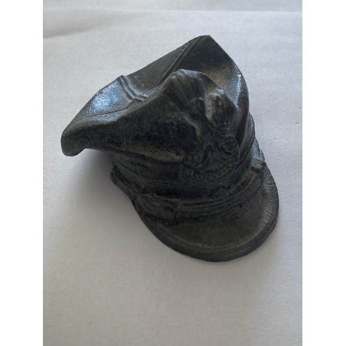 869 - A PRESENTATION PEWTER MODEL OF A SYRIAN MILITARY CAP. In a presentation red box, the hat 5cm high, 8... 