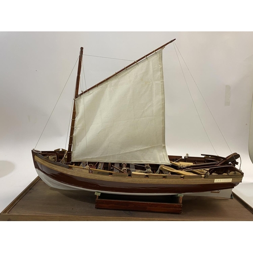 878 - A FINELY BUILT MODEL OF H.M.S. VICOTRY'S ANCHOR SLOOP. A well detailed model of a single masted sloo... 