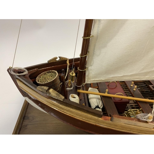 878 - A FINELY BUILT MODEL OF H.M.S. VICOTRY'S ANCHOR SLOOP. A well detailed model of a single masted sloo... 