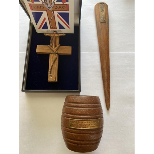 882 - HMS IRON DUKE AND HMS VICTORY FRAGMENTS. A small teak barrel and letter opener with attached panels ... 