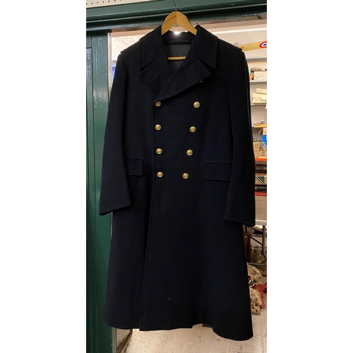 889 - A ROYAL NAVY GREAT COAT. A post Second World War Naval Great Coat by E.J. Whitaker and Sons of Chath... 