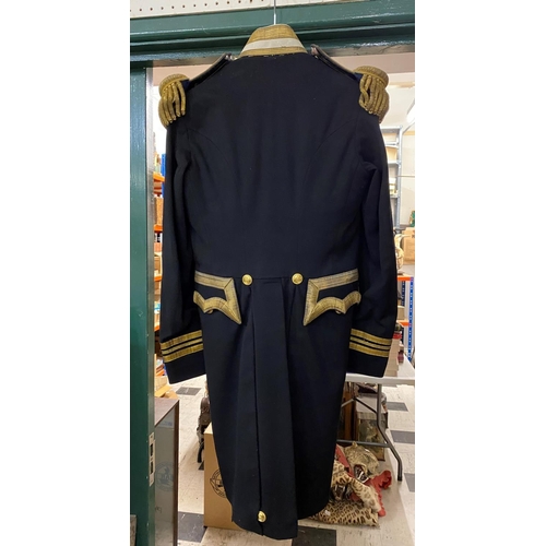 893 - AN EARLY 20TH CENTURY LIEUTENANT COMMANDERS TAIL COAT. A double breasted tail coat with 16 button fr... 