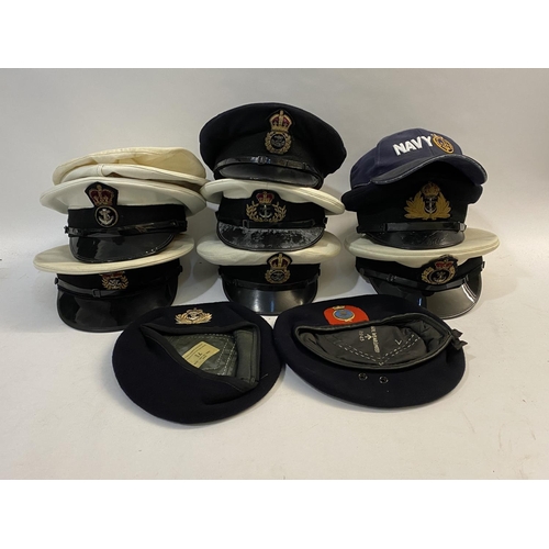 897 - A COLLECTION OF SECOND WORLD WAR AND LATER ROYAL NAVY CAPS. A collection of seven peaked caps, two d... 