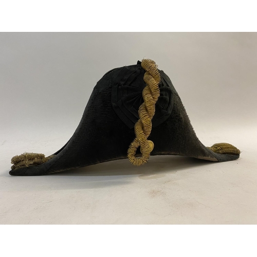 900 - A ROYAL NAVY BICORN HAT BY GIEVES IN BOX WITH ACCESSORIES. The Japanned Gieves box named for R.E. Lu... 