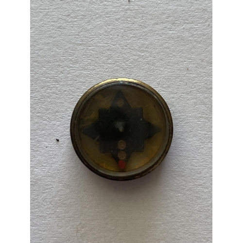 970 - A SECOND WORLD WAR BUTTON COMPASS. A small brass cased compass, possibly M19 SOE issue. 15mm wide.... 